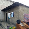 Parcelle en vente avec 4 portes de locataires et grand parking à N’djili Q6 22 Parcelle